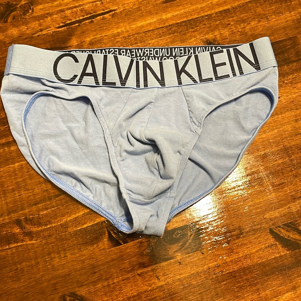 NWOT. Calvin Klein men’s briefs, size Med. light blue